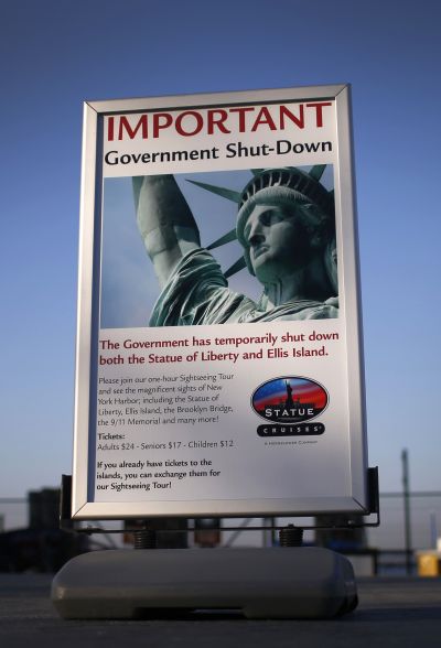 A sign announcing the closure of the Statue of Liberty, a US National Park, due to the US Government shutdown stands near the ferry dock to the Statue of Liberty in Battery Park in New York.