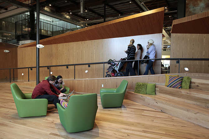 Employees sit in the 'Boardwalk' workspace at the Google campus near Venice Beach, in Los Angeles, California.