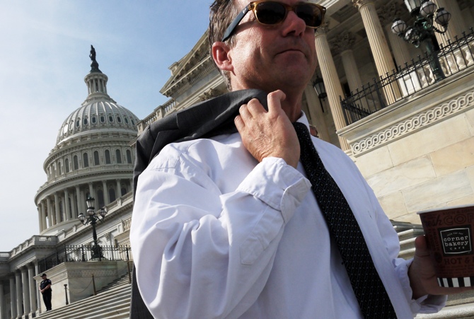 US Senator Rand Paul departs after a photo opportunity where he invited fellow legislators to have coffee on the steps of the U.S. Capitol during the government shutdown in Washington, on October 3, 2013.