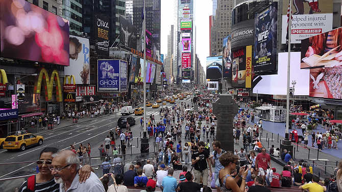 Tourists gather in Times Square in New York, United States.