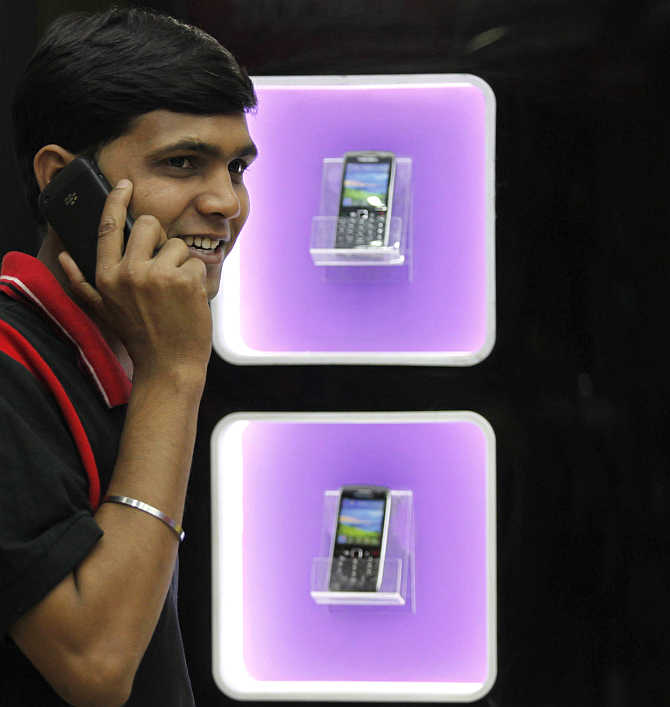 A man speaks on a mobile phone in Kolkata.
