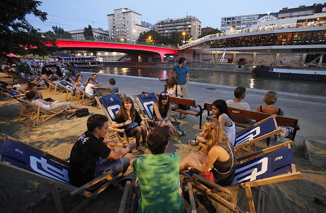 People enjoy the evening at Donaukanal in the centre of Vienna, Austria.