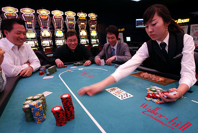 Men play poker at the Paradise Walker-hill casino in Seoul.
