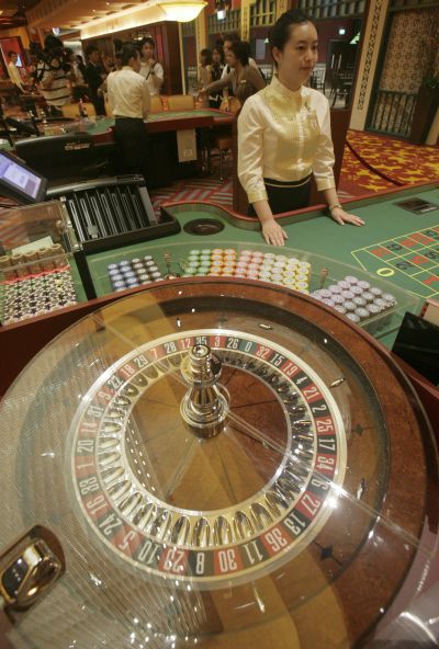 A croupier waits for gamblers at a table