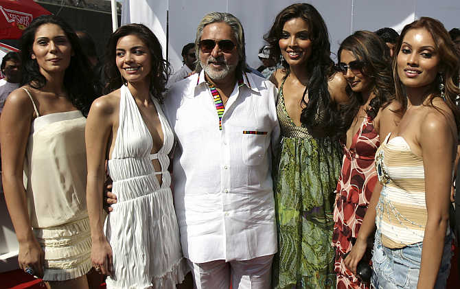Vijay Mallya with models at a function in Mumbai.