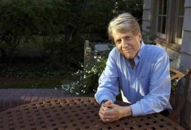 Robert Shiller, one of three American scientists who won the 2013 economics Nobel prize, poses at his home in New Haven, Connecticut.