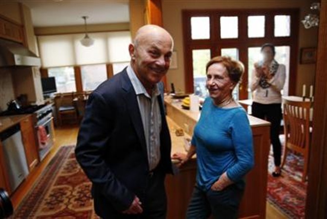 University of Chicago Professor Eugene Fama is pictured in his house with his wife Sally after finding out he won the 2013 Nobel Prize in Economics in Chicago, Illinois.