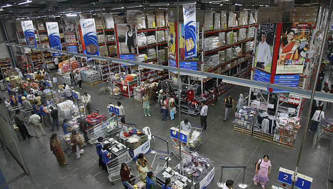 Customers shop at a Best Price Modern Wholesale store, a joint venture of Walmart Stores and Bharti Enterprises, at Zirakpur in Punjab.