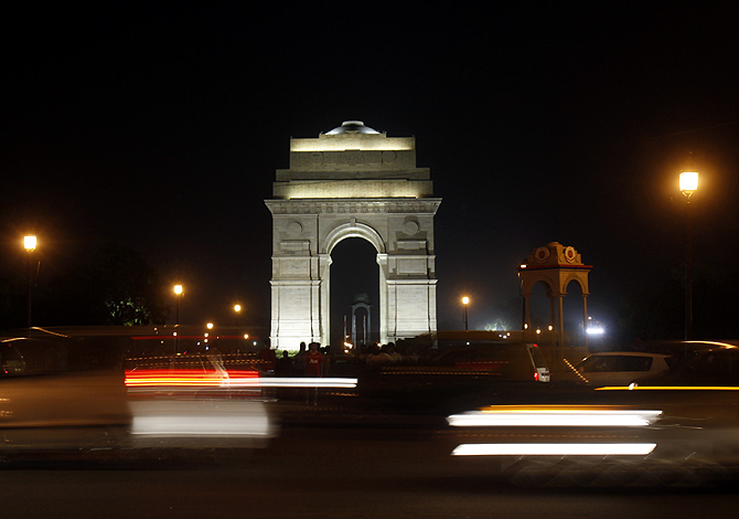 Traffic moves in front of the India Gate before Earth Hour in New Delhi.