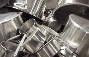 A  woman works in a factory that makes aluminium utensils. Photograph: Jayanta Dey/Reuters