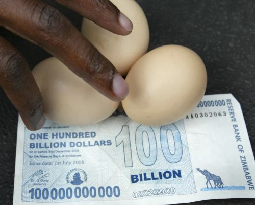 A vendor arranges eggs on a new 100 billion Zimbabwean dollar note in Harare.