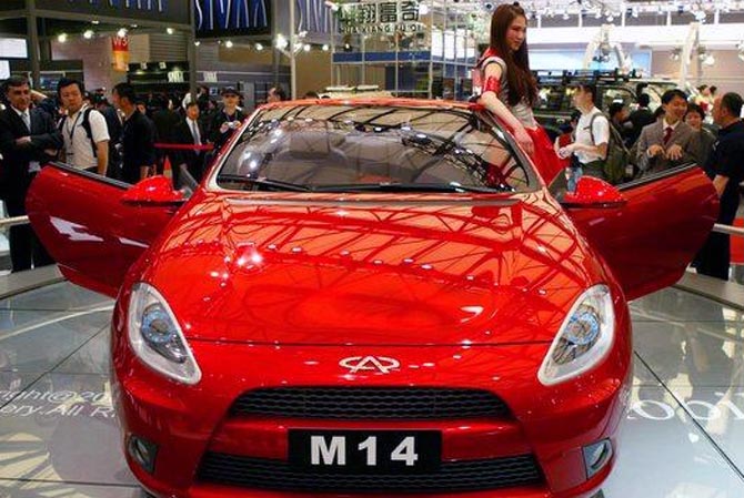 Visitors view China's Chery M14 car in Shanghai. 