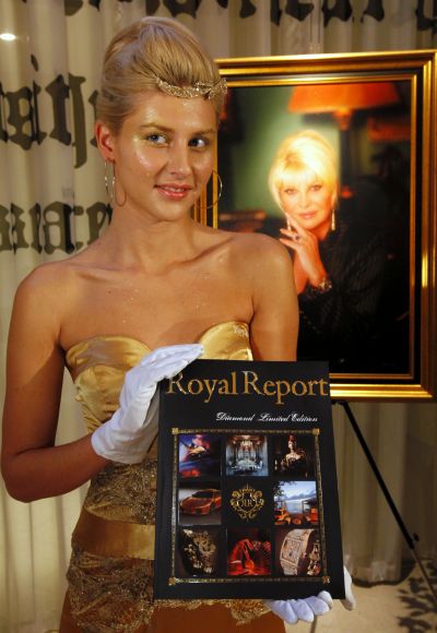 A model poses with a special edition of luxury magazine Royal Report in Prague.