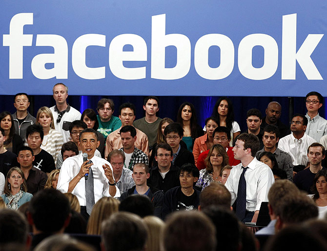 U.S. President Barack Obama attends a town hall meeting at Facebook headquarters with CEO Mark Zuckerberg in Palo Alto.