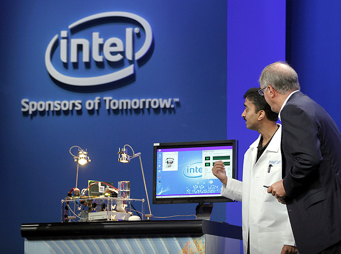 Intel CEO Paul Otellini looks over a prototype solar-powered computer during his keynote address at the Intel Developers Forum in San Francisco.