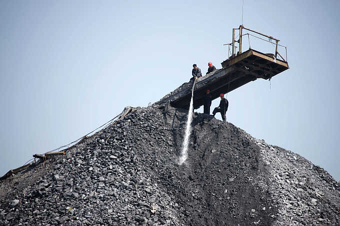 Employees work on a pile of coal gangue in Huaibei, Anhui province, China. Bumi Resources is the biggest thermal coal producer in Indonesia. Photos is for representation purpose only.
