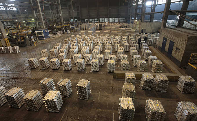 Workers store aluminium ingots at the Rusal Krasnoyarsk aluminium smelter in the Siberian city of Krasnoyarsk, Russia.