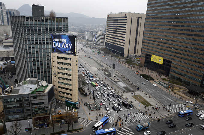 A Samsung outdoor advertisement sits atop an office building in Seoul, South Korea.