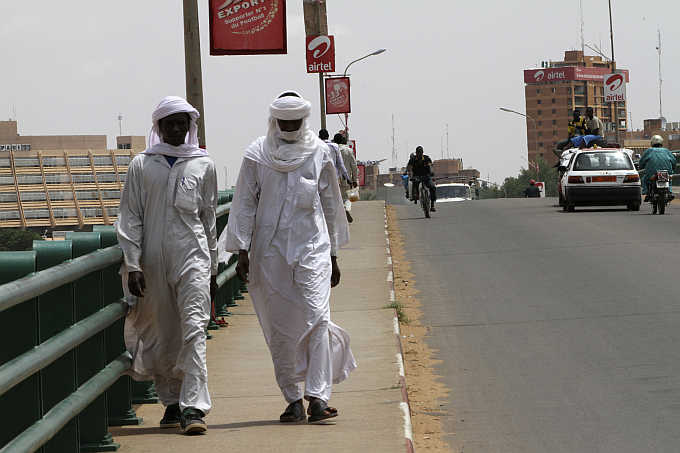 People walk along Kennedy Bridge in Niamey, capital city of Niger.
