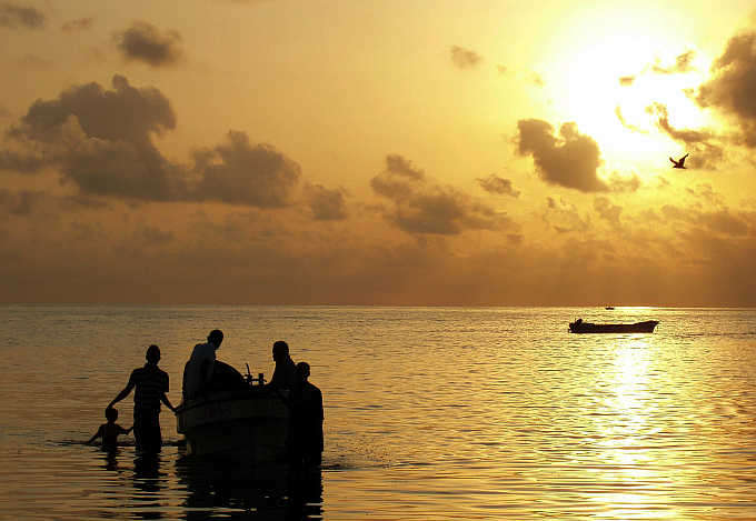 Fishermen slip away at dawn from the harbour in Obock town in Djibouti.