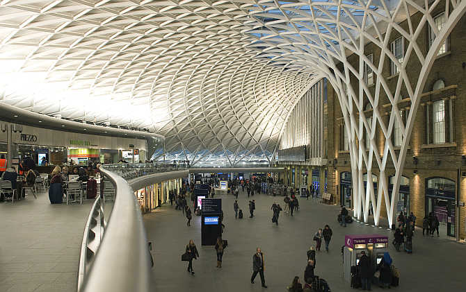 Passengers walk through King's Cross station in London, United Kingdom.