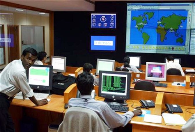 Engineers work in the control room at Infosys Technologies campus.
