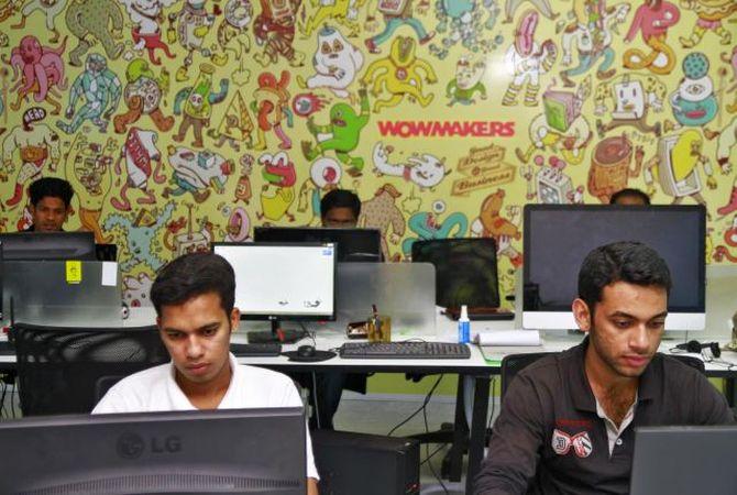 Professionals work on their computer terminals at the Start-up Village.