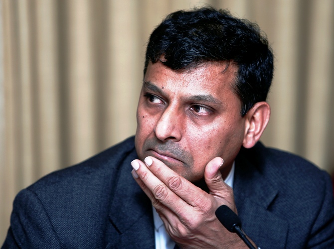 Reserve Bank of India Governor Raghuram Rajan listens to a question during a news conference after the mid-quarter monetary policy review at the RBI headquarters in Mumbai September 20, 2013.