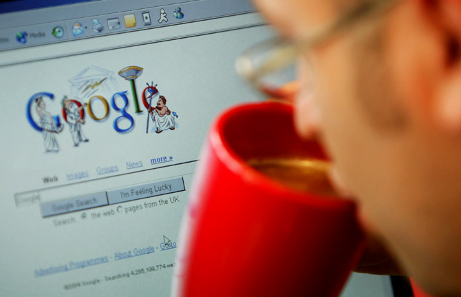 An internet surfer views the Google home page at a cafe in London