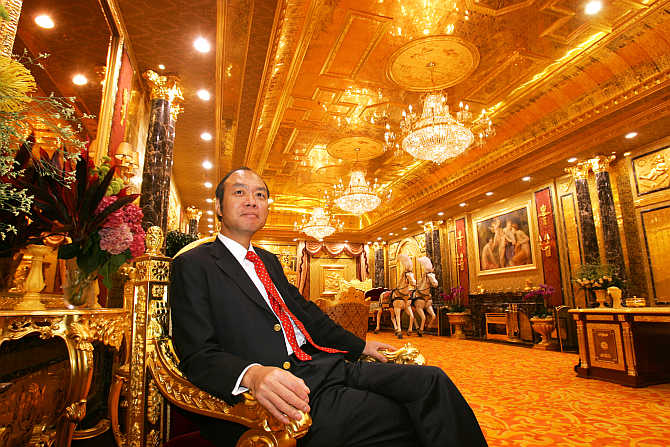 Lam Sai-wing, chairman of Hang Fung Gold Technology Group, poses in an exhibition hall decorated with two tonnes of gold next to his jewellery shop in Hong Kong.
