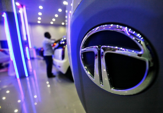 A worker cleans a Tata Motors vehicle inside the company's showroom on the outskirts of Agartala.