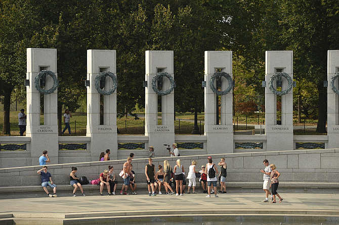 Tourists visit the World War II Memorial in Washington, DC, United States.