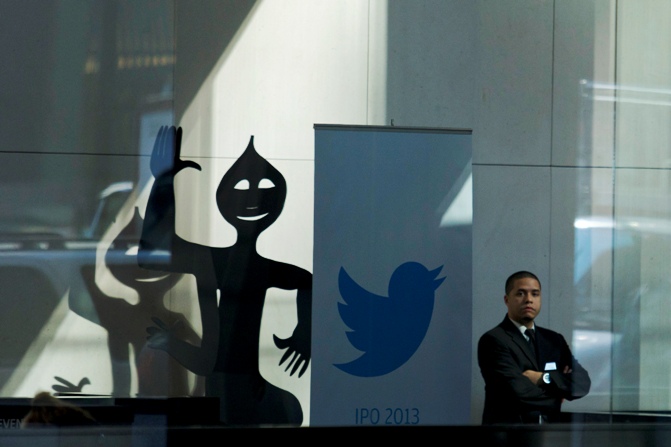 A Twitter banner is seen inside JP Morgan headquarters, before Twitter's IPO in New York, October 25, 2013. 