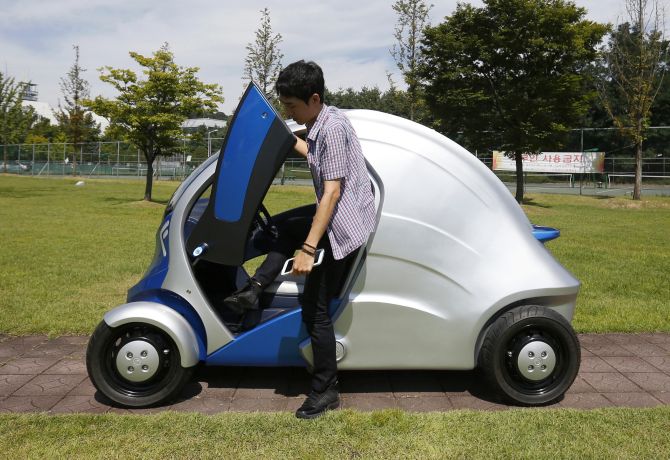 A researcher gets out of Armadillo-T, a foldable electric vehicle, at the Korea Advanced Institute of Science and Technology (KAIST) in Daejeon, south of Seoul.