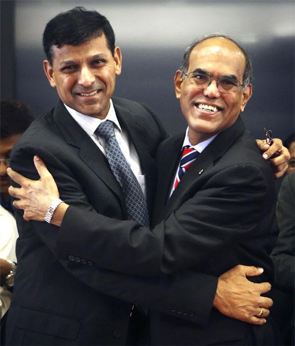 Raghuram Rajan (L), newly appointed governor of Reserve Bank of India, hugs the outgoing governor Duvvuri Subbarao during the taking over ceremony at the bank's headquarters in Mumbai.