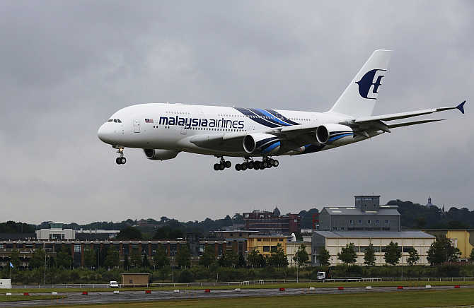 Malaysia Airlines's plane lands at the Farnborough Airshow in southern England.