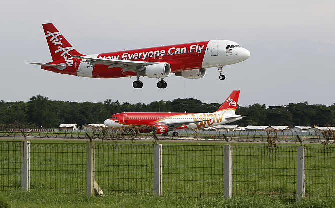 An AirAsia Airbus A320 passenger jet lands at Sukarno-Hatta airport in Tangerang on the outskirts of Jakarta, Indonesia.