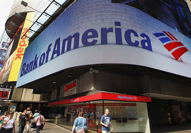 Tourists walk past a Bank of America banking centre in Times Square in New York City.