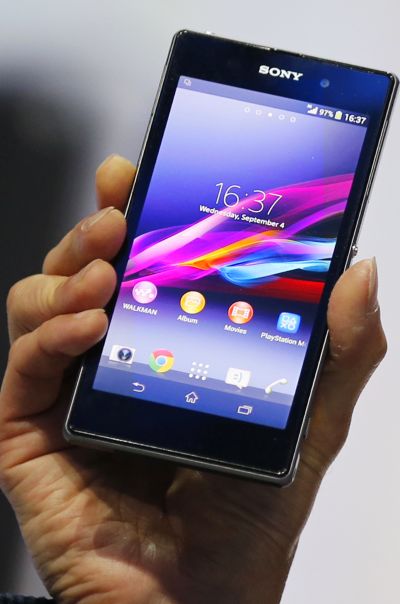 Sony Corp's President and Chief Executive Officer Kazuo Hirai presents a new Sony Xperia Z1 smartphone during it's world premier at the IFA consumer electronics fair in Berlin.