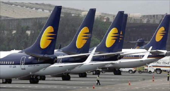 Jet Airways aircraft stand on tarmac at the domestic airport terminal in Mumbai. 