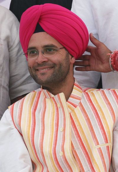 Rahul Gandhi, Indian parliamentarian and son of the chief of India's ruling Congress party Sonia Gandhi, smiles after wearing a turban during an election campaign rally in Mohali in the northern Indian state of Punjab.