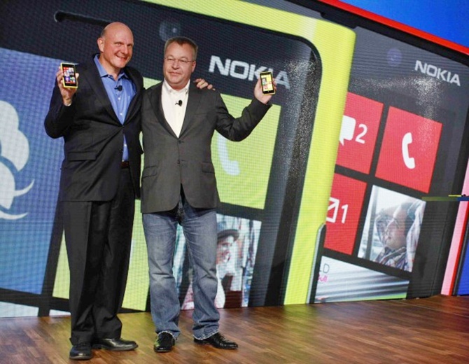 Microsoft CEO Steve Ballmer (L) and Nokia CEO Stephen Elop (R) introduce new Nokia phones with Microsoft's Windows 8 operating system at an event in New York.