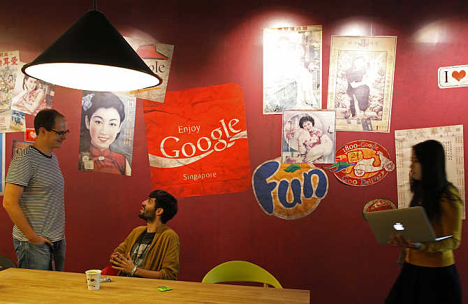 Google's employees at a pantry decorated with vintage Singapore advertisements and signages.