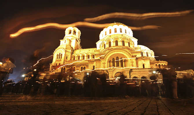 Worshippers walk around the golden-domed 'Alexander Nevski' cathedral after the Easter mass, in Sofia, Bulgaria.