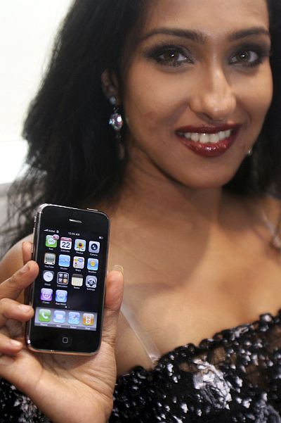Indian actress Rituparna Sengupta holds her new Apple iPhone.