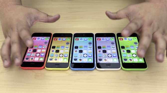 The new iPhone 5C in five colours are placed together at Apple Inc's announcement event in Beijing.