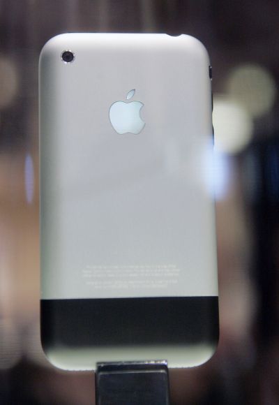 The new iPhone sits on display behind a glass case at the Macworld conference in San Francisco.