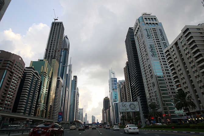 Motorists drive along Sheikh Zayed Road in Dubai, United Arab Emirates.