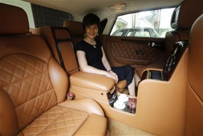 Bufori owner Tan eHong sits in her Bufori Geneva, which is fitted with a tea-making feature, at her residence in Kuala Lumpur.