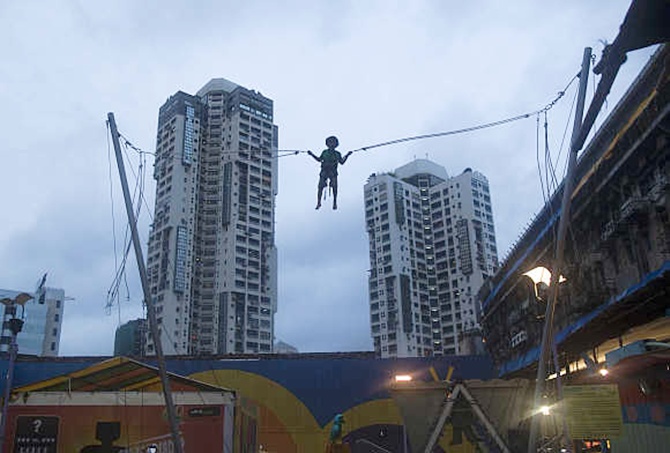 A boy plays on a giant trampoline in Mumbai.